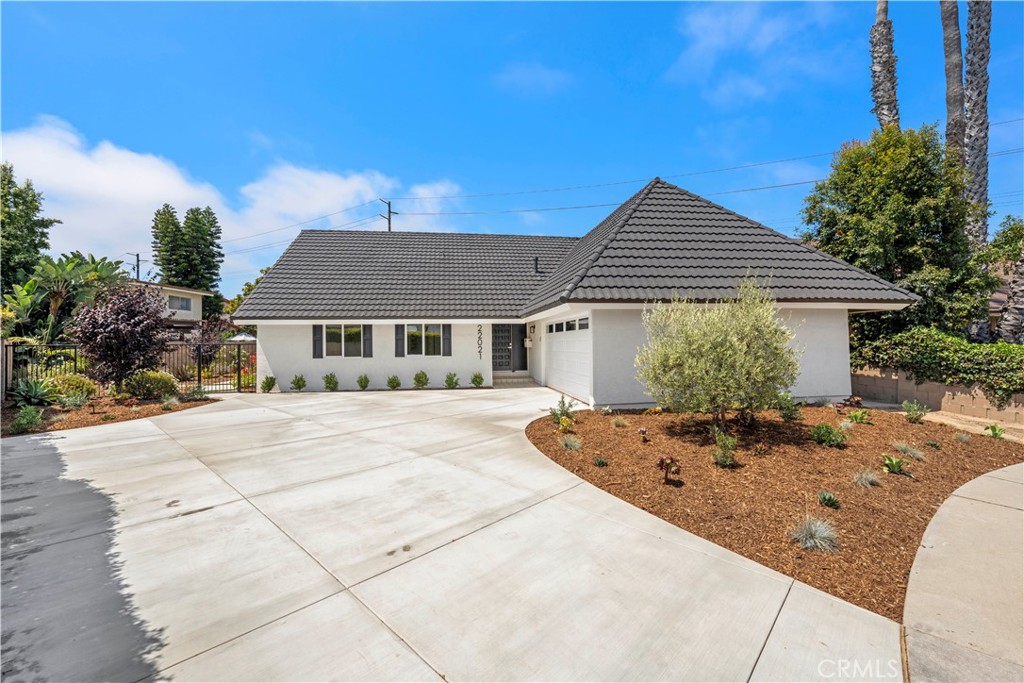 Nestled in a highly sought after pocket of South Huntington Beach, 22021 Jonesport Lane offers a large footprint, turnkey home on an expansive lot. Situated in the La Cuesta tract South of Banning, this residence features a 7,500sf lot along with 3,171 sf of fully remodeled living space. Step into an inviting open concept floor plan filled with an abundance of natural light and wood like vinyl plank flooring. The center of the home is the chef’s kitchen with a large island and farm sink, stainless steel appliances, quartz countertops, shaker style soft-close cabinetry and a walk-in pantry. Rare for a two-story, the main level offers 3 bedrooms and 2 baths allowing the home to live like a single-story. One of the ground floor bedrooms serves as a primary suite offering en-suite bathroom and walk-in closet. Adjacent to the staircase on the second level, you will find a large bonus room ideally suited for a home theater, playroom or extra entertaining space. In addition, the second level offers two generously sized bedrooms with walk-in closets. One of the bedrooms offers en-suite bath and could serve as a second primary. A true highlight of the home, the ample sized rear yard is low maintenance and a blank canvas for a future pool, outdoor entertaining area or even an ADU. Extensively renovated in 2023, this property received all new interior finishes, appliances, windows, electrical system, HVAC/AC and hardscape/landscaping. This home is less than a mile to the beach, award winning public schools, shopping/dining and in close proximity to Newport Beach and Costa Mesa.