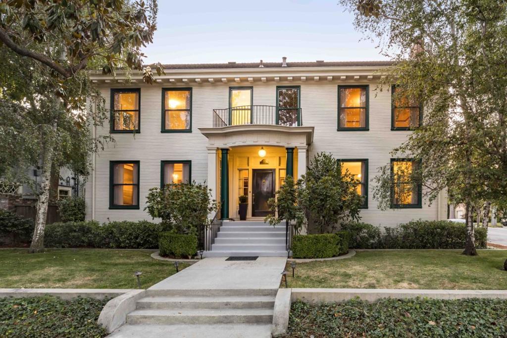 In the heart of Crescent Park, this stately colonial home offers a rare combination of presence, character, and livability. A column-framed entrance leads to warm interiors that showcase the home's more than century-old heritage, with hardwood floors, detailed millwork, and vintage glass doorknobs throughout. While the architecture reflects a bygone era, the layout feels comfortably in step with life today, featuring grand formal rooms, a cozy fireplace, a chef's kitchen with Viking and Sub-Zero appliances, and five generous bedrooms, four of which have en suite baths. The backyard is just as inviting, with a deck, brick pathways, and wisteria-covered trellises creating a peaceful space to relax or entertain. Additional highlights include air conditioning, a gated driveway, and a detached two-car garage. All of this, just a short stroll from the shops and restaurants of downtown Palo Alto, and close to Stanford University, Caltrain, commute routes, and top-rated Palo Alto schools.