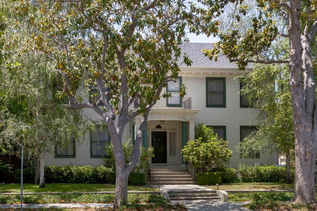 In the heart of Crescent Park, this stately colonial home offers a rare combination of presence, character, and livability. A column-framed entrance leads to warm interiors that showcase the homes more than century-old heritage, with hardwood floors, detailed millwork, and vintage glass doorknobs throughout. While the architecture reflects a bygone era, the layout feels comfortably in step with life today, featuring grand formal rooms, a cozy fireplace, a chefs kitchen with Viking and Sub-Zero appliances, and five generous bedrooms, many with en suite baths. The backyard is just as inviting, with a spacious deck, brick pathways, and wisteria-covered trellises creating a peaceful space to relax or entertain. Additional highlights include air conditioning, a gated driveway, and a detached two-car garage. All of this, just a short stroll from the shops and restaurants of downtown Palo Alto, and close to Stanford University, Caltrain, commute routes, and top-rated Palo Alto schools.