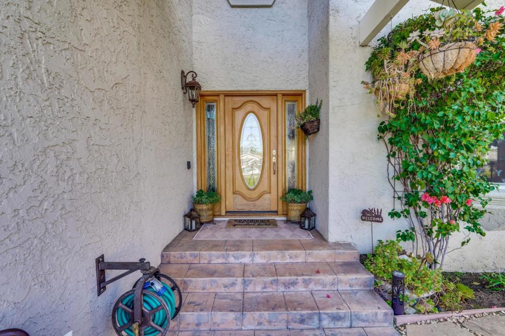 Nestled against the Blossom Valley foothills with no rear neighbors - a rarely available must-see property! Meticulously expanded & remodeled in 2004 & 2021, this Mediterranean-inspired home spans over 3,000 sf on a lg pie-shaped quiet cul-de-sac lot w/unobstructed views of the hills. Incl a grand primary suite w/2 walk-in closets & private balcony, bonus rm, family rm w/cozy gas F/P, living rm w/vaulted ceilings, bay windows, laundry rm, mudroom, sunroom w/dry & wet bars, DUAL-ZONE central A/C & heat, recessed lighting & ceiling fans. The beautifully landscaped yard is an oasis w/ lg Travertine tile patio & custom-built pergola w/heaters, lights & ceiling fan, custom built-in BBQ w/bar seating, upper garden on terraced hillside, private courtyard, two storage sheds, lg lawn, fruit trees & beautiful plantings. The stunning gourmet kitchen is perfect for culinary enthusiasts w/lg island, garden window, custom cabinets, granite countertops, informal dining area, GE Monogram SS appliances w/dbl gas oven range w/grill & griddle, x-lg refrigerator, dishwasher, microwave & warming drawer. Gleaming hardwood floors adorn the foyer, kitchen, & formal dining w/brilliant Swarovski crystal chandelier. Great schools, easy commutes, close to shopping, parks, hiking trails & more. Welcome home!