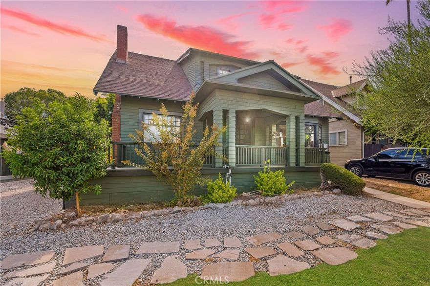 Welcome to 6450 York Blvd, Highland Park — a beautifully preserved two-story home blending timeless character with thoughtful updates. Elevated above the street, the front deck with swing chair overlooks a lush lawn and fruit trees, creating an inviting first impression. Inside, original hardwood floors, vintage details, and modern touches complement a flexible layout featuring four spacious bedrooms plus a fifth bonus room ideal for an office or guest space. The upstairs bath showcases a classic clawfoot tub with period-style fixtures, while the downstairs suite with adjoining full bath offers privacy for guests or extended family. A convenient quarter bath near the kitchen adds everyday functionality. The bright dining area opens to a welcoming living room, perfect for gatherings, while the kitchen’s butcher block counters and antique stove bring warmth and charm. Outside, enjoy a private backyard with a covered pergola—ideal for relaxing or entertaining—and two large Tuff Sheds for extra storage or creative use. The home also features newer dual-pane windows and upgraded copper plumbing, offering peace of mind alongside its classic charm. This home captures the best of Highland Park living: historic character, modern comfort, and a setting that feels truly special.