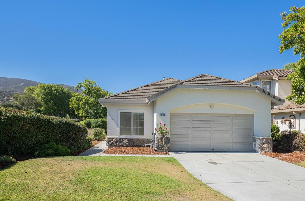 This sparkling, single story home is nestled on a quiet street in the desirable Las Palmas 2 community. Freshly updated and move-in ready, this property offers new flooring, fresh paint, and a landscaped yard with beautiful mountain views. The open floor plan is filled with natural light, creating a warm and inviting space for everyday living or entertaining. The private primary suite has vaulted ceilings, garden views and a walk in closet. Enjoy the community's resort-style amenities including a pool, spa, and multiple parks. With modern updates inside and a peaceful outdoor space, this home blends the comfort, and convenience of active California living. Please note the den can be enclosed to create a third bedroom.