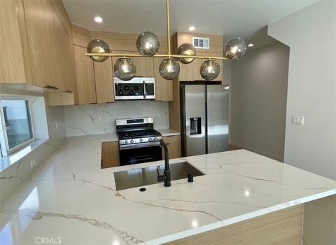 Photo of 611 W 41st Place #1/2, Los Angeles, CA 90037 (MLS # OC25262073)