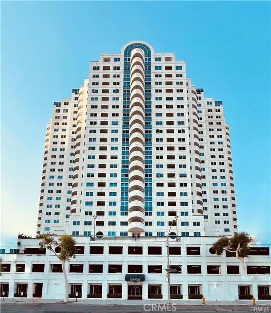 Discover the exceptional lifestyle you've always dreamed of in this premier two-bedroom, two-bath condominium at the luxurious Harbor Place Tower. Located in the vibrant heart of Downtown Long Beach, this residence offers a sophisticated living experience with breathtaking ocean and city views, Step into a bright, open-concept floor plan designed for modern living. Both bedrooms are adorned with large glass windows, perfectly framing panoramic views of the Pacific Ocean and the iconic Queen Mary, complete with a private balcony for enjoying the coastal breeze.  The  modern kitchen boasts  granite countertops, stainless-steel appliances, ample cabinet space, and a convenient breakfast bar. The spacious primary suite  features two sets of mirrored closets and an en-suite bathroom with an oversized tub, separate walk-in shower, and dual vanities. For added convenience, it comes with a washer/dryer tucked inside the closet and two assigned deeded tandem parking spaces. Harbor Place Tower offers a comprehensive suite of resort-style amenities, transforming your daily life into a vacation. Enjoy a refreshing swim in the pool and spa, relax by the outdoor lounge with a cozy fireplace, or host gatherings at the built-in BBQ facilities. Stay active in the fully equipped fitness center and unwind in the sauna room, hold meetings at the conference room. Plus, with 24/7 concierge and on-site security, your peace of mind is assured. A standout feature is the ocean-facing balcony, an ideal spot for entertaining and observing major events like the Grand Prix. This property's strategic location puts you at the center of it all. Enjoy the convenience of close proximity with easy access to the Convention Center, The Pike, the beach, the marina, and major transportation routes. With the forthcoming 2028 Olympic Games, this residence presents a unique opportunity to be perfectly positioned in a world-class event hub.