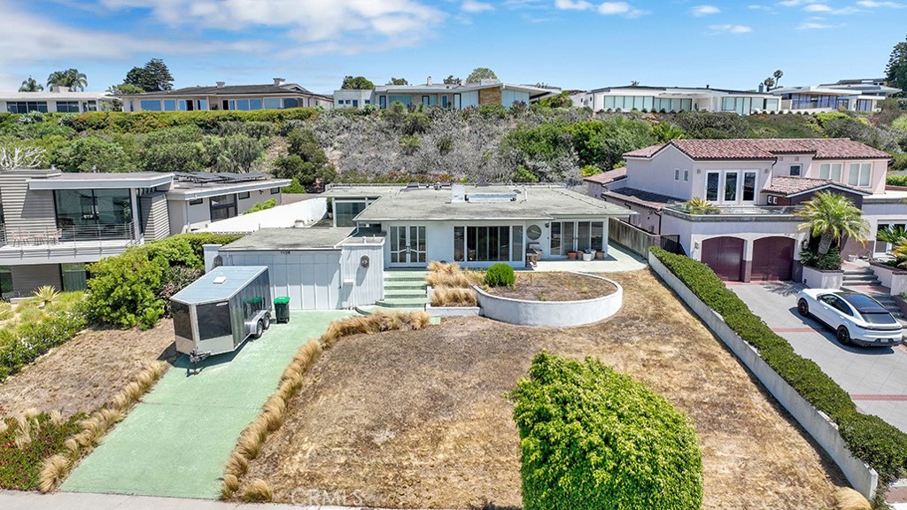 A rare and remarkable offering in the coveted Harbor View Hills of Corona del Mar. Perched on an expansive 14,250 SF parcel with sweeping ocean and sunset views, this property presents the ultimate opportunity to design and build a one-of-a-kind coastal estate. The existing structure offers a perfect starting point for reimagining or replacing with your vision of luxury living. Set in one of Orange County’s most prestigious neighborhoods, you’ll enjoy unmatched proximity to world-class beaches, upscale dining, Fashion Island, and the charming boutiques of Corona del Mar Village. A location and lot of this caliber are exceptionally rare—secure your place in this exclusive enclave and bring your dream home to life.