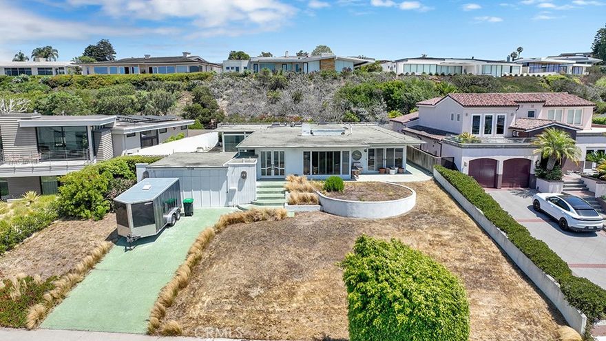 A rare and remarkable offering in the coveted Harbor View Hills of Corona del Mar. Perched on an expansive 14,250 SF parcel with sweeping ocean and sunset views, this property presents the ultimate opportunity to design and build a one-of-a-kind coastal estate. The existing structure offers a perfect starting point for reimagining or replacing with your vision of luxury living. Set in one of Orange County’s most prestigious neighborhoods, you’ll enjoy unmatched proximity to world-class beaches, upscale dining, Fashion Island, and the charming boutiques of Corona del Mar Village. A location and lot of this caliber are exceptionally rare—secure your place in this exclusive enclave and bring your dream home to life.
