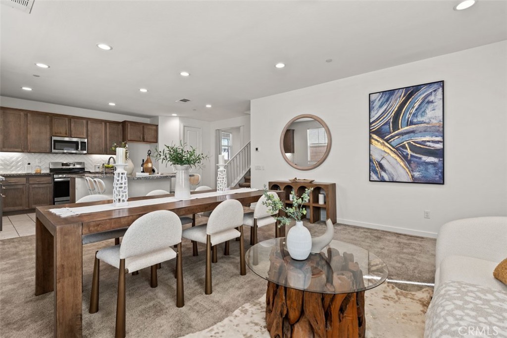 Priced to sell! Welcome to this nearly new two-story home in the heart of Ontario! Built in 2022, this property residence offers 4 bedrooms, 3 bathrooms, and a loft, with 2,365 square feet of living space. At the entrance, a bedroom with a full bath is situated on the left—ideal for parents and guests. The foyer flows naturally into an open-concept layout filled with abundant natural light. The contemporary design seamlessly connects the living, dining, and kitchen areas, creating an inviting space for both everyday living and entertaining. The modern kitchen is a chef’s delight, featuring stainless steel appliances, granite countertops, ample cabinetry, and a pantry. A large island with a breakfast nook provides the perfect spot for casual dining. Upstairs, additional bedrooms and a versatile loft further enhance the home’s comfort and functionality. Conveniently located near shopping and dining, with easy access to Freeways 60 and 15, this property presents an excellent opportunity for both living and investment. Adding to its appeal, the brand-new Ontario New Haven Elementary School—currently under construction—is scheduled to open in 2026, truly within walking distance.