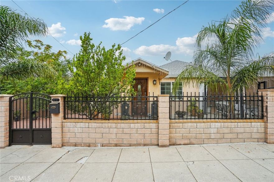 Welcome to 10141 McClemont, a charming 2-bedroom, 2-bath home tucked behind private gates for comfort and peace of mind. This 900 sq ft residence begins with a welcoming entry, where paved walkways and fruit trees set the perfect tone. Inside, the light-filled living room opens to an updated kitchen featuring a large island, soft-closing drawers, custom backsplash, stainless steel appliances, and plenty of storage, ideal for both everyday living and entertaining. The spacious primary suite offers multiple closets and a private bath with a stand-up shower, while the second bedroom, with its wall-to-wall closets, is currently enjoyed as a versatile office/TV room. A full hallway bath with a shower-over-tub completes the thoughtful floor plan. Out back, you’ll find a cozy yard designed for entertaining, along with a large storage unit and laundry closet. Fresh, clean, and move-in ready, this home is waiting for its next owner to enjoy.