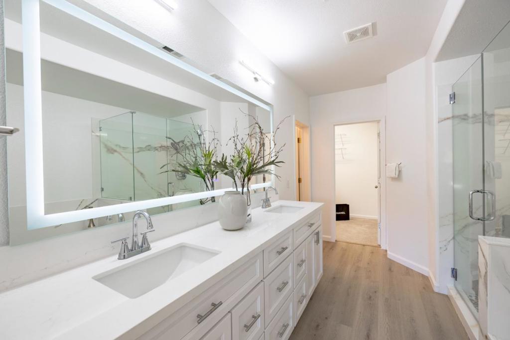 Vivid and spacious two-level 3 Bed/2.5 Bath home situated in the highly desirable Terrabay Village community in South San Francisco! A fully updated unit that brings you extensive finishing touches from top to bottom. Hardwood floors throughout the ground floor that gets you out of your comfort zone. An open floor plan that connects dining to living with elevated ceilings and updated lighting. A fully updated kitchen features new appliances, quartz countertops, a standout backsplash, and additional storage & pantry! Fully renovated primary ensuite bathroom is complete featuring double sink vanities, smart mirrors & lighting, new tub and shower finishes alongside an updated custom primary closet. Two additional bedrooms with new carpet, and an updated fully remodeled guest bathroom complete the bottom floor. Retreat to 2 custom decks with breathtaking views of the peninsula! A laundry room with washer/dryer and bonus storage areas throughout! With an attached 2-car garage and additional storage included, you don't want to miss out on this Terrabay gem! Welcome home.
