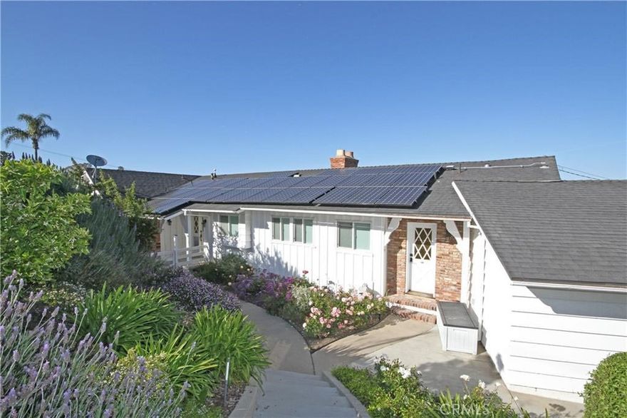 Welcome to this exquisite 3-bedroom, 3-bathroom home nestled in the serene hills of Rancho Palos Verdes. This stunning residence boasts a tastefully remodeled kitchen, adorned with sleek stone countertops and equipped with top-of-the-line stainless steel appliances including a refrigerator, dishwasher, double oven and an extra freezer for added convenience (in craft room).

As you step outside, you'll be greeted by the epitome of outdoor luxury - an inviting in-ground saltwater pool and spa, surrounded by elegant pavers, offering a tranquil oasis with a panoramic view of the surrounding landscape.

The primary bedroom is a sanctuary in itself, featuring a private bathroom complete with a luxurious soaker tub, separate shower, and a dual sink vanity, providing the ultimate retreat for relaxation and rejuvenation.

Situated on an expansive sloping lot spanning over 27,933 square feet, this property offers an abundance of outdoor space adorned with flourishing pomegranate, lemon, blood orange, avocado, and fig trees, creating a picturesque and bountiful landscape.

Entertaining is effortless with multiple spaces designed for gatherings, including a charming porch overlooking the harbor and city lights, where you can unwind and revel in the breathtaking views.

The open living and dining room areas are adorned with two decorative fireplaces, adding warmth and ambiance to the already inviting space, creating the perfect setting for cozy evenings with loved ones.

For those who appreciate creativity and productivity, this home also features a dedicated craft room or office space with plentiful storage, providing the perfect environment for pursuing hobbies or handling business matters with ease.

With its impeccable blend of luxury, comfort, and natural beauty, this Rancho Palos Verdes home presents an unparalleled opportunity to indulge in Southern California living at its finest.