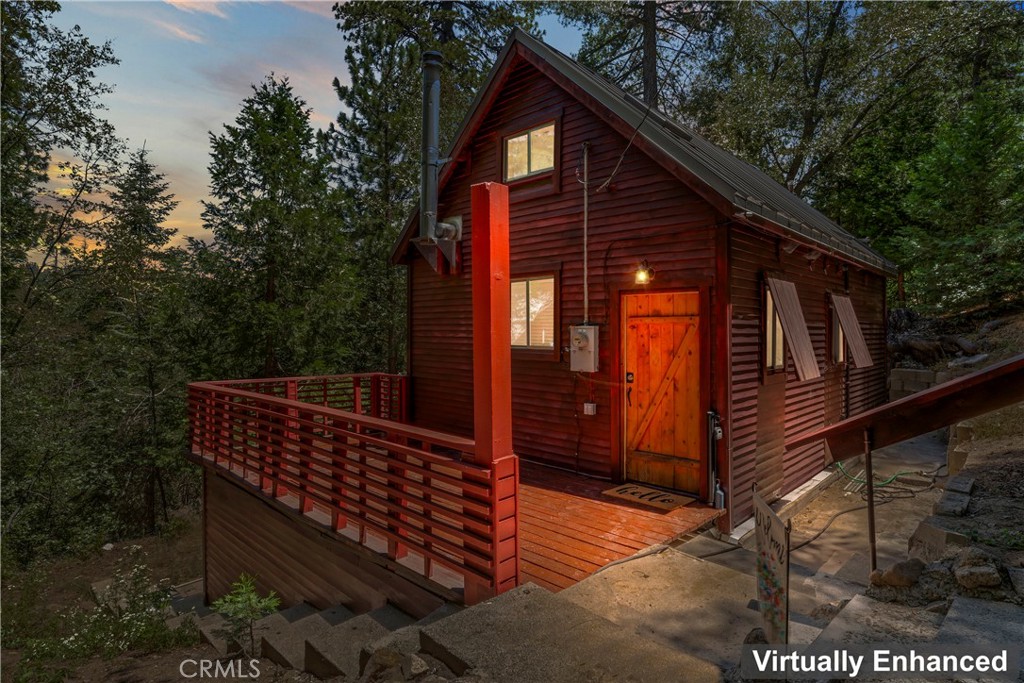 Price Improvement! Vintage Mountain Charmer on a large 15,000 sq foot lot with amble parking. Cabin Built in 1952 with Metal Roof and Skylight. Circular staircase to main bedroom, open concept. Wood Burning stove, wood flooring. Located in Twin Peaks community of Strawberry Lodge. Centrally located between Crestline and Lake Arrowhead. Mature Trees offer a sense of seclusion and privacy. Nice size deck for entertaining and or just a quiet moment sipping coffee and taking in the beauty of nature. Entrance off the front deck onto main living, kitchen open concept. There is an additional room of the main living area that has been used as a sleeping quarters, up the spiral staircase is additional loft/bedroom with built in nook and storage. Cabin and decks have been recently stained. Perfect cabin for those weekend getaways.