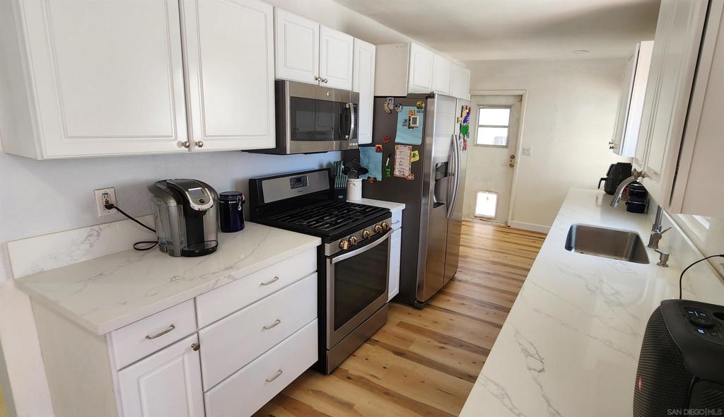 Welcome to your beautifully updated 4-bedroom, 2-bathroom home! With a New Roof, New Interior and Exterior Paint, Refinished Kitchen Cabinetry, Granite Countertops and New Flooring, this home is move-in ready and boasts a ton of valuable upgrades! A 2 car garage and dedicated RV parking offers ample space for your recreational vehicles, boats, or extra cars.