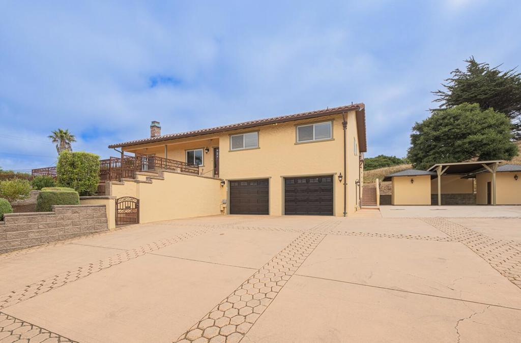 Welcome to this charming 3-bedroom, 2-bathroom home. With 1,640 square feet of living space, this inviting residence features an updated kitchen/family room equipped with stone countertops, Thermador appliances, two built-in refrigerators, and a pantry area, making it perfect for culinary endeavors. The kitchen seamlessly connects to the family room, providing a cozy atmosphere for gatherings. The home boasts high and vaulted ceilings that enhance the sense of space and openness. Enjoy the comfort of heated tile flooring throughout most of the house. The living room includes a fireplace, ideal for relaxation during chilly evenings. Convenience is key with an inside laundry area, ensuring ease of access. Enjoy those family BBQ's with the outdoor living space and TV area. The property offers energy-efficient features such as double-pane windows, low-flow toilets, and a tankless water heater. Situated on a spacious lot with plenty of room for parking oversize vehicles, 2 large storage sheds with a carport, and your very own practice putting green. The 2-car attached garage also has an extra storage room/office area. Home comes is an exterior camera system and backup generator. This home is a must-see for those seeking comfort and functionality close to Salinas.