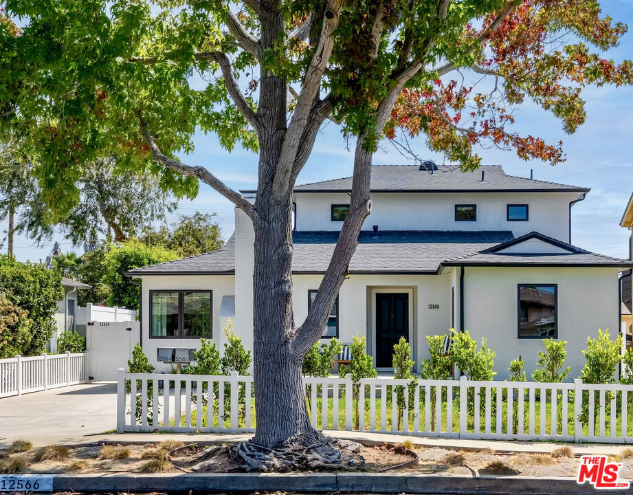 Two single family homes on one lot! The front home is a 2,000sqft, 3 bedroom, 3 bathroom, turnkey home. The back ADU, built in 2020, is a 648sqft, 1 bedroom, 1 bathroom home with it's own address, private access and yard. This thoughtfully upgraded compound pairs timeless style with modern function. All of this situated on an oversized lot with dual street access allowing for tons of flexibility. The 2-level main house recently went through major upgrades including new roof, new custom windows, fully remodeled bathrooms (2024) finished in Carrara marble, frameless glass shower doors, fresh interior paint. Crown molding, dark-stained oak hardwood floors, and a wood-burning fireplace bring warmth and character, while a sunlit family room opens directly to the lush backyard. The chef's kitchen features bright Carrara marble countertops and a clean, efficient layout. All utilities are underground, including internet, cable, and telecom wiring. The 1 bedroom/1 bathroom guest house ADU, built in 2020 by Sowa Development, offers 648 square feet of modern, self-contained living with its own private entrance, separate utilities, and a fully wired infrastructure for internet, security, and smart features. Inside, you'll find vaulted ceilings, central HVAC, a tankless water heater, and a custom chef's kitchen with quartz countertops, a 6-foot island, built-in laundry closet, and custom cabinetry. The oversized bedroom includes a walk-in closet and a spa-style bath. Outdoors, enjoy a private, protected patio exclusive to the guest house, perfect for guests, tenants, or a work-from-house set up. Additionally, accordion tri-fold doors create seamless indoor-outdoor flow to the main yard, perfect for entertaining or family fun. Outdoor amenities are equally impressive, with extensive top cast/sand-finished patios, porches, walkways, and driveway creating seamless flow and an elevated aesthetic throughout the property. The expansive yard features manicured landscaping, mature fruit trees, 20-foot privacy hedges, grassy lawns, and full-perimeter white vinyl fencing. A custom Vista lighting system adds a warm glow in the evenings, perfect for outdoor gatherings in a parklike setting. This property is more than a home it's a versatile compound that balances elegance, comfort, and opportunity. Come explore one of Mar Vista's most sought-after pocket neighborhoods, offering easy access to some of the Westside's favorite restaurants and shops - Beethoven Market, Bluey's, Alana's Coffee, and so much more. In addition, this location offers easy access to LA's best beaches and parks. A rare offering in Mar Vista's hottest neighborhood!