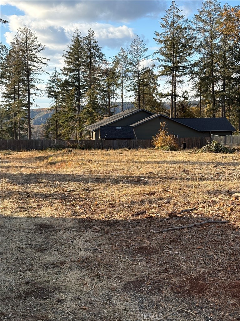 Check this one out! This beautiful property sits on almost a half-acre on Skyway but is situated on flag lot, keeping it tucked back off the main street. The central location is ideal for someone hoping to build their dream home in Paradise. PID water service is active and in “ready to serve” status! The previous home was a 2 bedroom, 1 bathroom with 1015 sq. ft. Seller has kept the lot in great shape and will provide the fire defensible space lot clearance before close. Go take a look!