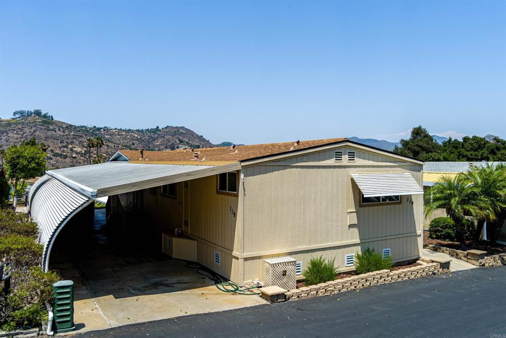 Immaculate, well maintained home at Rancho Monserate Country Club. Turn key, ready for you to move in and make it your own. Enjoy panoramic views, and the afternoon breeze. Open, light and bright, low maintenance landscape with upgrades inside and out including a custome designed Master Bathroom. Large shed, wide lot with lots of possibilities. Free golf, tennis, pickleball, walking trails, too many activities and amenities to list and you own the land! Enjoy the resort lifestyle and great North County locaton!