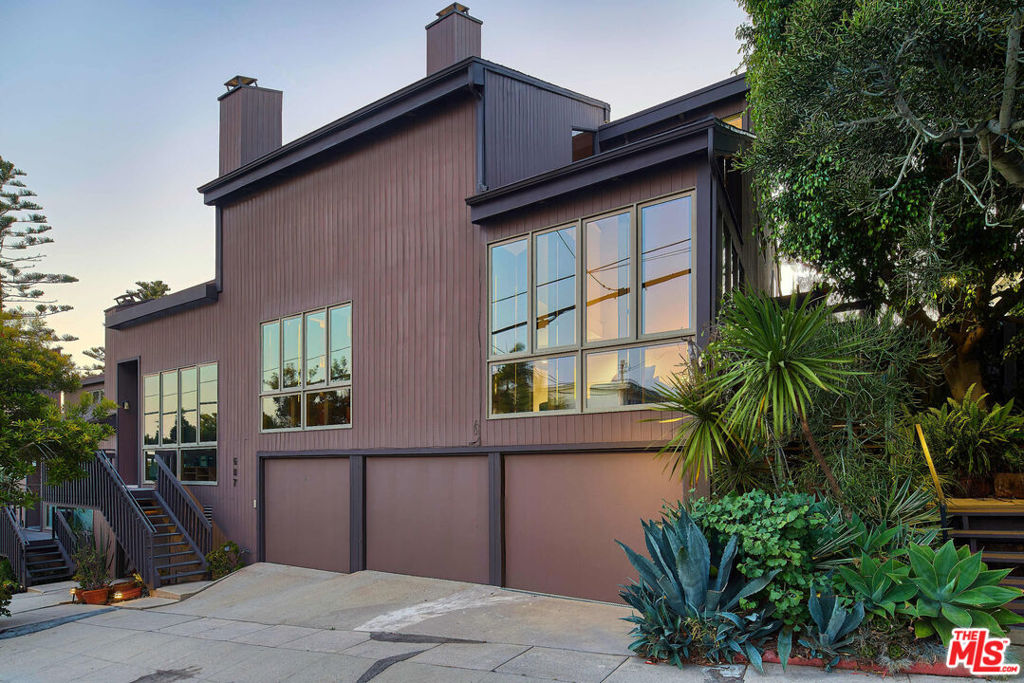 Charming End-Unit Townhome With Ocean Views! Nestled in a prime Santa Monica location just six blocks from the beach and directly across from scenic Joslyn Park and the local dog park, this lovingly maintained end-unit townhome offers the perfect blend of coastal living and everyday convenience. Set in a small building with only five units, the home boasts privacy, charm, and character throughout. Upstairs, you'll find three comfortably sized bedrooms, including a spacious primary suite with soaring vaulted ceilings, a private ocean-view deck, and plenty of natural light. The main level features a functional kitchen with an adjacent dining area that opens onto a tree canopied private deck that is ideal for casual entertaining or relaxing with friends and family. Additional highlights include a laundry room, direct-access two-car garage, a bonus room, and thoughtful layout for easy day-to-day living. While this trust sale property could benefit from a few updates, it has been well cared for and offers exceptional value and potential in the desirable Ocean Park neighborhood. Just minutes from the beach, farmer's market, top-rated restaurants, and beloved local shops, this is coastal California living at its best.