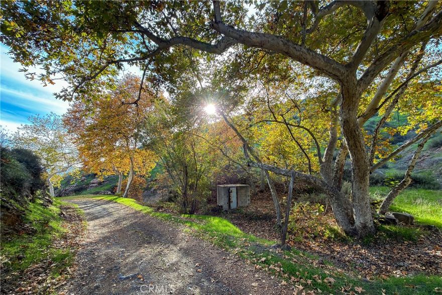 Stunning views from this 6.5-acre property up in the hills above Lake Elsinore!  Enjoy the end-of-the-road privacy in this unusually pretty location.  The driveway and flat pad will give you a head start on building and save you some money.  Well and septic needed.  Electricity is in the area.  The property is in Riverside County, just outside Lake Elsinore city limits.  So, for building information, check with the County, not the City.  No reports or plans. Go for a drive and walk the land any time!