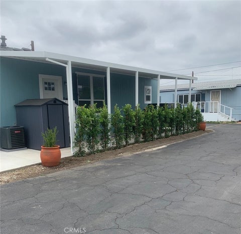 Photo of 9023 Rose Street #C-12, Bellflower, CA 90706 (MLS # DW26204410)