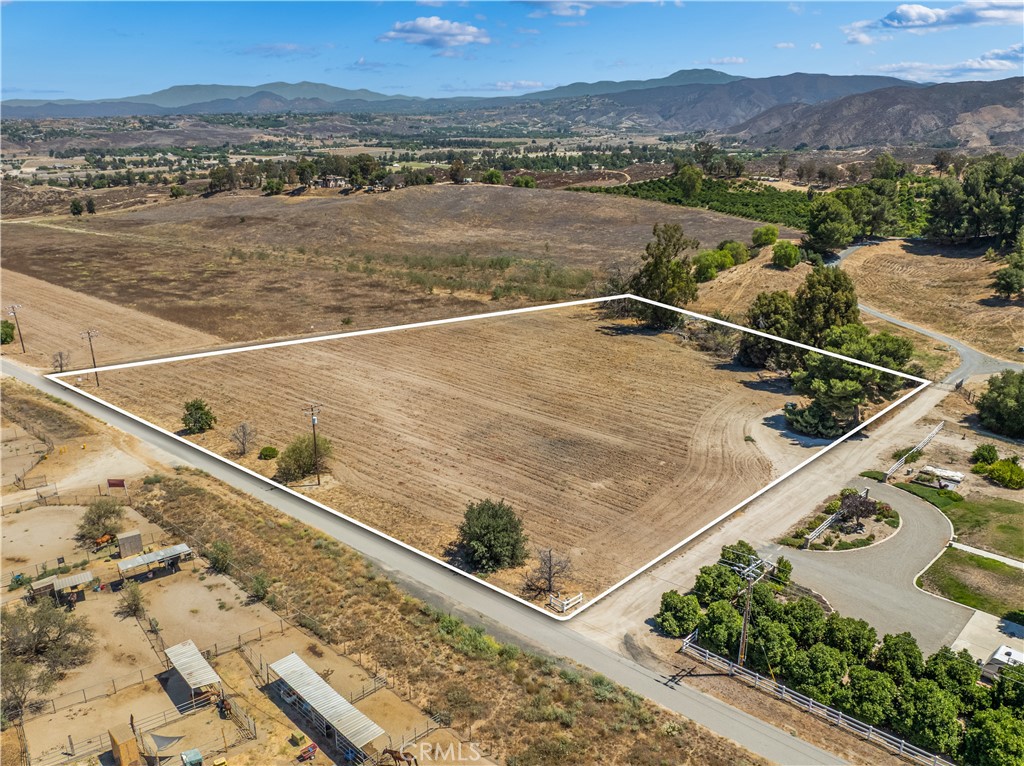 Ready to build your dream homestead in the heart of wine country? Welcome to 0 Via Riata—a rare gem offering just over 3 acres of flat, usable land in one of Temecula’s most sought-after areas, the Wine Country. This property is off of a paved road! Tucked away on a peaceful country road, yet conveniently close to shopping, hospitals, top-rated schools, Old Town Temecula, Pechanga Resort, and just 15 minutes from the I15 freeway, this property strikes the perfect balance between tranquility and accessibility. Bring your horses, your chickens, your recreational vehicles, your gardening gloves, and your big dreams—this land is ready for it all. Whether you envision a custom-built estate, a charming ranch, or a family compound with room to roam, this property offers the space and flexibility to make it happen. No HOA and the corners are marked, look for the orange ribbon. Blue skies, mountain views, and the sweet promise of country living—Temecula style. Let your homesteading dreams take root here at Via Riata!