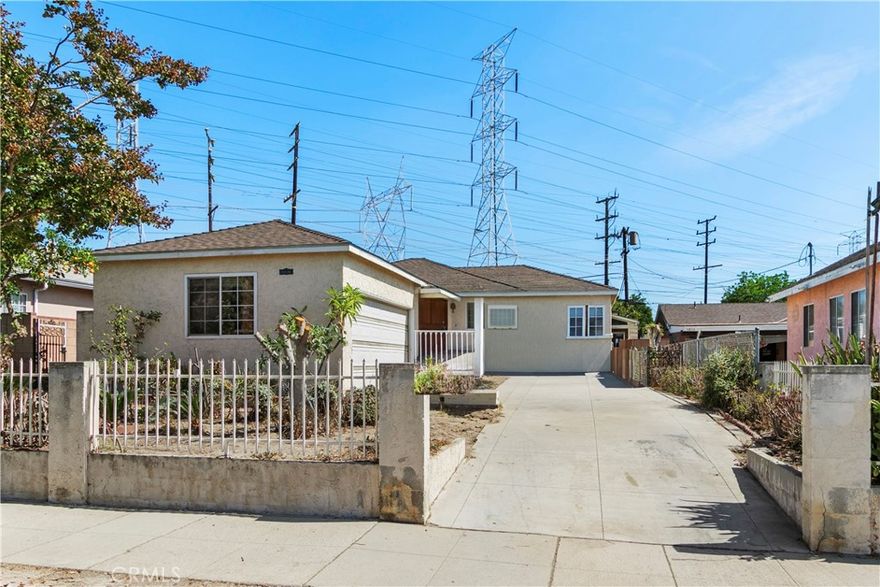 Fantastic purchase opportunity on this 3 br 2 ba home with a large backyard for limitless possibilities.  Covered porch, spacious living room with beautiful wood floors, dining room with wood floors, bright kitchen with stainless steel refrigerator and stainless steel freestanding range/oven, vented exhaust fan in kitchen, primary bedroom and bath, mirrored wardrobe doors, separate family room, covered patio area, laundry area in patio, 2 car attached garage, and huge backyard.  Location convenient to schools, shopping and freeways.  Don't miss out!