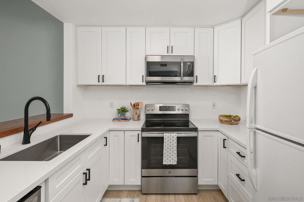 Move right into this turnkey 4th-floor condo, offering stylish upgrades and modern comfort. The home showcases recessed lighting, LPV flooring, and update kitchen. The peninsula bar seating is perfect for entertaining, while the remodeled bathroom adds a sleek, contemporary touch. Enjoy the convenience of in-unit washer/dryer hookups, a walk-in closet, and a newer A/C system for year-round comfort. Step outside to your spacious private patio with beautiful views, the ideal spot for morning coffee or evening relaxation. Additional features include one assigned underground parking space and a location that can’t be beat—walking distance to shops, dining, and more. This home is ready for its next owner!
