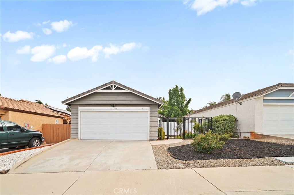 Welcome to 27780 Hillpointe Dr, a charming single-story home located in the heart of Menifee. This 2-bedroom, 2-bathroom residence offers 927 square feet of living space on a spacious 5,227 sq ft lot. From the moment you arrive, you're greeted by a gated front patio and a vibrant garden featuring fruit trees, including pomegranate, cherry, plum, and lemon guava, setting a welcoming tone.
Step inside to vaulted ceilings and an open living area filled with natural light. The kitchen flows seamlessly into the living room and features a gas range, tile countertops, and an updated sink, perfect for casual entertaining or cozy nights in. The primary bedroom includes its own ensuite bathroom with a shower, while the secondary bedroom is adjacent to a full bath with a new toilet and a shower/tub combo. A convenient indoor washer and dryer setup adds to the home's functional layout.
Out back, enjoy your own private retreat with a pergola-covered patio, grassy area, peach tree, cozy brick firepit, and seating area ideal for relaxing evenings or weekend gatherings. Additional upgrades include brand-new windows and a new sliding glass door that opens to the backyard.
Just a short walk away, enjoy access to the community pool and park. Situated in the growing city of Menifee, this home offers a lifestyle that blends comfort, community, and convenience. With new shopping centers, schools, and easy freeway access nearby, Menifee continues to expand while still offering a relaxed suburban feel. Whether you're a first-time buyer or looking to downsize, this home is a wonderful opportunity to settle into a welcoming neighborhood with room to grow and enjoy.