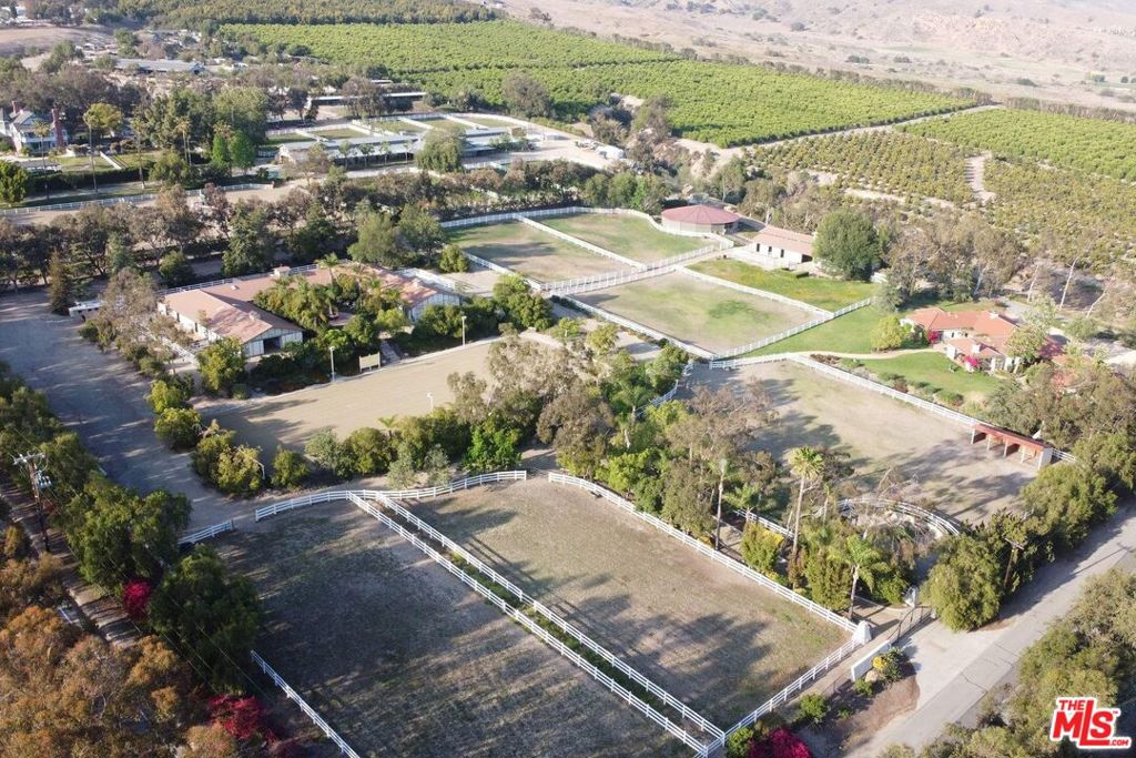 The Acres is an equestrian paradise located less than an hour from Beverly Hills, featuring a world class equestrian facility with 10 acres of verdant landscaping, rolling green pastures, and a beautiful Spanish Mediterranean custom estate complete with guest house. The California Spanish designed main house has 3BR + 2.5BA with over 5,000 sf. of spectacular indoor/outdoor living spaces, including a cooks kitchen with top-of-the-line appliances, beamed ceilings, custom Pella French doors, and lush outdoor garden verandas. The boutique-style detached guest house has 1BR + 1BA, living room and designer gourmet kitchen. The property offers sweeping views of extensive landscaping, manicured gardens, courtyard fountains, and rolling lawns of irrigated green pastures. The world class equestrian center has 40 stalls, many opening to individual paddocks. The state-of-the-art lighted, all weather (HSPG) dressage arena is mirrored and has GGT footing material. There is a covered Euro-exercise arena, club house, grooms apartments, tack rooms, wash racks and hay barn. There are several 1 to 2 acre fenced grass pastures and the property offers miles of trail riding located adjacent to the Santa Monica Mountains Conservancy. A truly one-of-kind equestrian paradise with endless possibilities, rarely found so near the exclusive and fashionable Los Angeles Westside.