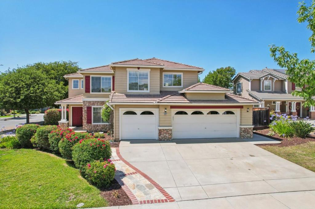 Elegant & thoughtfully updated home situated on a premium corner lot in the prestigious California Oak Creek community in the heart of Evergreen. This spacious 4-bedroom + versatile downstairs bonus room, 3-bath residence is designed for comfort & modern living. Step inside to soaring ceilings, a grand split staircase & expansive windows that flood the home w/ natural light. The open-concept kitchen complete w/ stainless steel appliances, a wall-mounted double oven & generous cabinetry for all your culinary needs. The kitchen flows seamlessly into a cozy family room w/ a fireplace, perfect for gatherings or quiet evenings at home. A new sliding glass door leads to the private backyard oasis, ideal for gardening, or simply relaxing in a peaceful setting. Recent upgrades: brand-new plush carpeting & fresh designer interior paint throughout. Upstairs, retreat to the luxurious primary suite featuring vaulted ceilings, walk-in closet & a spa-inspired en-suite bath w/ dual vanities, soaking tub, & separate shower. Additional highlights include central heating and A/C, in-unit laundry room, 3-car attached garage & ample driveway parking. Located in a quiet, tree-lined neighborhood served by top-rated Evergreen schools: Silver Oak Elementary, Chaboya Middle & Evergreen Valley High.