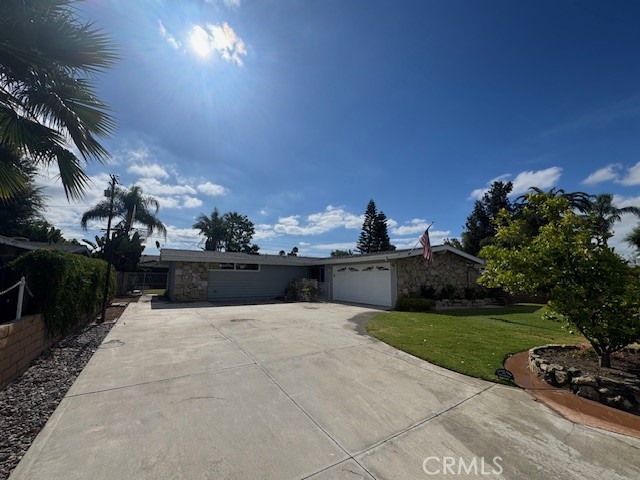This beautifully updated Mid-Century modern single-story residence offers an inviting and versatile floorplan. At about 1,736 sqft, it includes three bedrooms and two full bathrooms, highlighted by vaulted wood beam ceilings, hardwood floors, and skylights that flood the living spaces with light. The living area features a cozy family room with a romantic gas-insert fireplace with remote control. Adjacencies include a large game/media room with its own air-conditioning unit, ideal for gatherings or entertainment. The kitchen is a galley-style layout with quartz countertops and a custom bump-out breakfast nook, complemented by a drop-down dining room and a dedicated interior laundry area
Set on a generous 7,208 sqft lot at the end of a quiet cul-de-sac, the home enjoys privacy and potential outdoor amenities such as space to add a private pool. A large storage shed is included. The long paved driveway accommodates at least six vehicles in addition to the attached two-car garage. A new roof was installed in 2021, ensuring structural peace of mind. Its central location provides easy access to the I-5 and I-55 freeways, and is just 15 minutes from Orange County Airport and 25 minutes to Newport Beach. Plus, it lies within the highly regarded Tustin school district, with schools rated among the top in the area and within two miles of the property
New interior and exterior paint, home is awaiting your furniture and is basically turn key ready.
House is currently owned by USMS and will be sold AS IS at their discretion. Agent will disclose full details of sale. All information contained here in is deemed reliable, however it is the responsibility of buyer and buyer's agent to confirm.