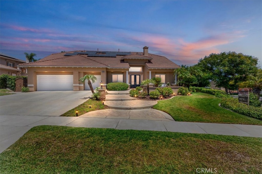 Rare One-Story Gem – No HOA or Mello-Roos!
This highly desirable single-story home is a rare find, offering 3,183 sq ft of living space on an expansive 13,939 sq ft corner lot—with no homeowners association and no Mello-Roos!
Step through the grand double glass entry doors into a home with 13-foot ceilings throughout and a thoughtfully designed mother-in-law floor plan, featuring two spacious primary suites on opposite ends of the home for maximum privacy.
The elegant layout includes a formal living and dining room, and a chef’s island kitchen with creme-glazed cabinets, soft-close drawers, stainless steel appliances, double ovens, a cooktop stove, breakfast nook, under-cabinet accent lighting, and reverse osmosis water system.
Additional interior highlights:
*Three fireplaces
*Travertine and wood flooring
*Crown molding and plantation shutters
*Ceiling fans and French doors
*Butler’s pantry with space for a second refrigerator
*Built-in entertainment center in the family room
*Spa-like master bath with jacuzzi tub, step-in shower, and walk-in closet with built-ins
* New Pex plumbing
*Cul-De-Sac
Resort-style backyard perfect for entertaining includes:
*Sparkling pool and spa with reef step, waterfalls, fire pit and rock slide
*Half-court basketball court
*Built-in island BBQ, side burner, refrigerator, fire pit, and Alumawood patio cover with ceiling fans
*Stamped concrete, mature tropical landscaping, and fruit trees
Other features include:
*Leased solar system
*EV charger
*Energy-efficient LED lighting throughout
*This stunning home offers luxury, functionality, and fun, all in a prime location and in a top rated school district!