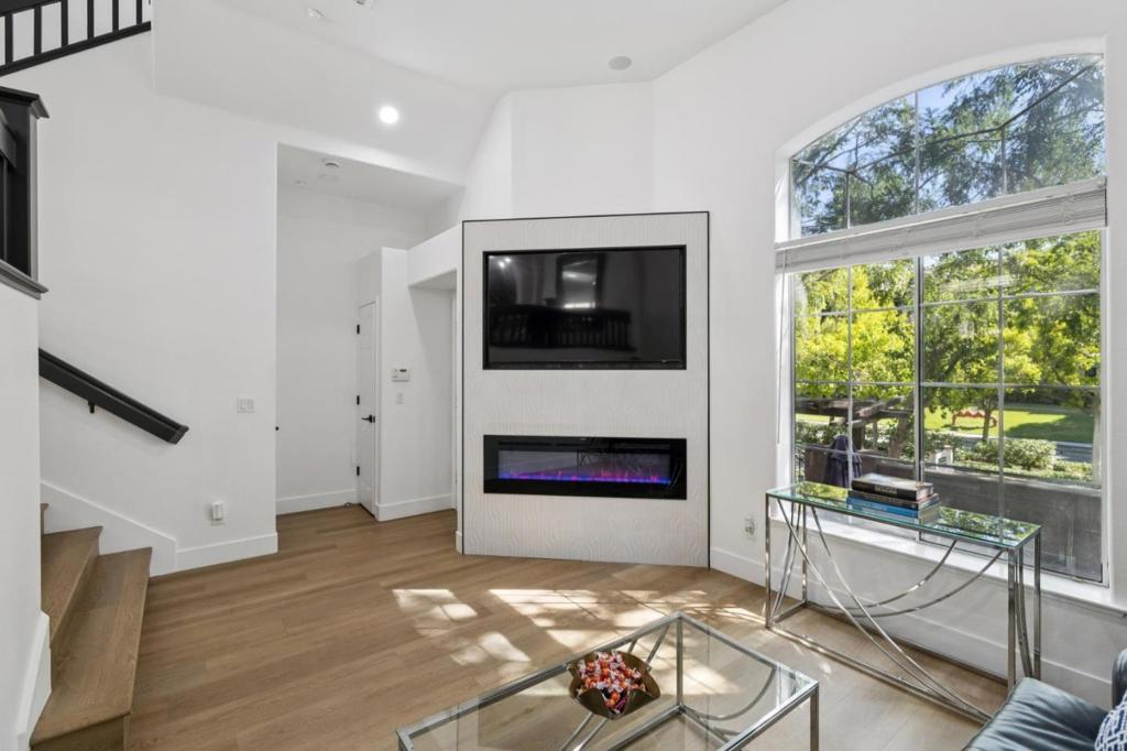 Welcome to this modern, fully renovated and beautifully upgraded townhouse, located in the highly desirable Willows community of Willow Glen, San Jose. From top to bottom, this home has been transformed into a stylish, serene retreat-move-in ready and brimming with modern elegance. Highlights Include: All-new luxury vinyl wood flooring; fresh, designer paint in every room; brand new recessed lighting; sleek, updated kitchen with all-new stainless steel appliances and quartz countertops; all-new window blinds for privacy and light control; brand new bathrooms featuring imported European tile, modern floating vanities, and dual shower fixtures; ceiling fans in every bedroom for airflow and comfort; brand new entertainment wall with custom tilework and electric fireplace; surround sound system; every Bedroom is a private suite; spacious 2-Car Attached Garage with additional storage space. Charming Community Living with tree-lined streets, manicured lawns, a community gazebo, and park. Located in a prime location and just minutes away from San Jose International Airport and downtown Willow Glen. Step inside and fall in love with this modern masterpiece in one of San Jose's most beloved neighborhoods. Come see it today, this one won't last long!