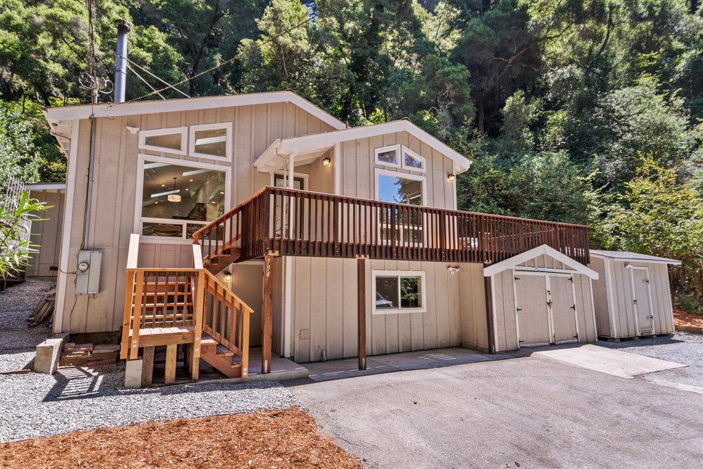 Craving a peaceful retreat surrounded by majestic redwoods, yet just minutes from all the conveniences of town? Welcome to 794 Cathedral, nestled in the heart of Aptos. Located near Aptos Village, hiking in Nisene Marks, and long walks on Seacliff Beach, this spacious 2-bedroom, 3-bath home offers the best of both worlds, nature and convenience. Vaulted ceilings and large windows fill the living spaces with natural light while framing serene forest views. The generously sized bedrooms feature large windows, maximizing light and connecting you to the surrounding beauty. The kitchen, complete with a brand-new 36' range, is ready for creating delicious meals to enjoy with family and friends whether gathered in the inviting common area with the wood burning stove, or outside on the fabulous 500+ sqft deck. Step into the tranquil backyard to relax, unwind, or gaze at the stars under the canopy of trees. The downstairs bonus room provides flexible space for storage or customization, with additional storage available for all your outdoor toys. Ample parking in front of the home completes the package. 794 Cathedral isn't just a house, it's your perfect Aptos retreat.