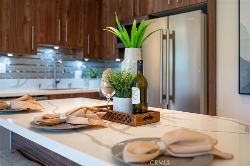 A 3.625% interest rate. Yes. How would you like to buy this condo with a low starting interest rate of 3.625%? The seller is contributing to a 3-2-1 buydown program, giving you a first-year rate as low as 3.625%. Don't miss this opportunity to save big on your mortgage payments. Welcome to your dream home in Newport Beach's resort-style gated community. This newly remodeled gem is ideally situated for quintessential Newport Beach living, just a short stroll away from the beach, restaurants, Lido Village, 17th Street, art and culture, world-class surfing, fishing, swimming, and aquatic sports activities. Here, you'll enjoy endless entertainment options, from annual festivals, tournaments, shows, and boat parades. As you step inside, you'll be greeted by an open floor plan with abundant lighting, high-end designer touches, brand new tile floors, new European cabinetry, and modern hardware. The living room is the heart of the living space and leads to a private balcony with fresh ocean breezes, perfect for entertaining guests or just relaxing with your favorite drink. The community of Versailles is known for its resort-style living, boasting highly secure buildings, a large swimming pool, Jacuzzi, a beautiful clubhouse, fitness room, gated underground parking, an elevator, and extra storage. The HOA pays for water, trash, and sewer, so you can relax and enjoy all the amenities without worrying about the details. The property also features SMART HOME technology, allowing you to control the lighting with a simple smartphone app, as well as Wi-Fi connectivity for the washer/dryer for easy operation and maintenance. For those looking for an investment opportunity, this is where resort-style living meets lucrative investment potential. This newly remodeled gem is not just a residence; it's a smart financial move. Ideally situated near the beach and Hoag Hospital, this property has proven itself as an exceptional investment, consistently generating high rental income. Don't miss out on this fantastic opportunity. Schedule a viewing today!
