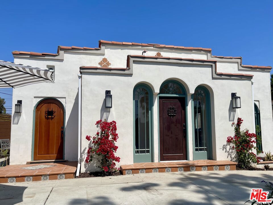 Located in the heart of LA's most vibrant areas with easy access to the city's most iconic and trendy spots with just minutes from Larchmont Village, Melrose, LACMA, La Brea Tar Pits, Culver City, Beverly Hills, The Grove, the Original Farmer's Market, Hollywood, Koreatown, Downtown LA and more - truly a hidden gem in the middle of it all. An incredible opportunity to own a beautifully remodeled duplex in the highly sought-after Brookside/Hancock Park neighborhood. Live in one unit and rent out the other, or enjoy dual-income potential in a prime Los Angeles location. This thoughtfully updated property features two distinct units, each approximately 966 sqft, 1Bed, 1Bath and Formal Dining Area. A guest bathroom added to one unit. You'll see how each unit has its own unique character and abundant natural light. Both kitchens and bathrooms have been fully renovated with stylish finishes, new appliances, and new vinyl plank flooring runs throughout. The exterior boasts brand-new, professionally designed landscaping in both the front and back yards. The front yard includes an irrigation system and newly planted privacy hedges and plants as you enter the driveway with automatic gated entry. There's still more - the backyard offers a serene escape with decomposed granite, mature greenery, and privacy plants that create a true urban oasis. Explore the potential of building an ADU on the spacious 6,252 sqft lot and/or converting the detached garage - subject to city regulations. Another added perk - the garage is equipped with a 220-volt EV Charging Station. No more long lines to charge your EV vehicle. Don't miss this turnkey investment in one of LA's most charming and centrally located neighborhoods! (More photos to come).