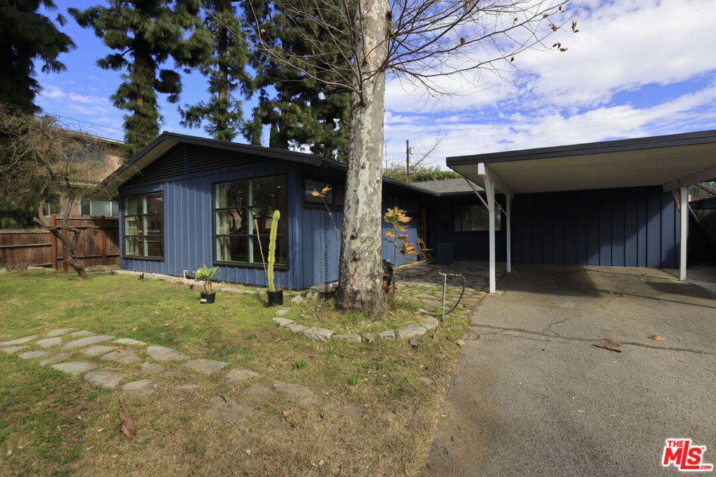 Come home to this stunning, mid-century modern bungalow in highly sought after Lake Balboa. The gracious living room boasts massive windows that provide beautiful natural light. The charming kitchen comes fully equipped with stove and range hood, stainless steel refrigerator, dishwasher, and microwave. The adjacent dining area is ready for entertaining, and the built-in window seating is the perfect place for your morning cup of coffee. Three spacious bedrooms offer options galore. The primary suite contains contains ample space for a home office nook. The third bedroom is currently set up as a den/office, but can easily be converted. The renovated primary bath provides a spa-like retreat. Step outside to find a full dining set under the covered patio, with lush greenery and abundant seating options in the backyard. Recent upgrades include new double-pane windows in multiple rooms, complete bathroom renovations, new flooring, and an updated kitchen. In addition, both the exterior and interior have been lovingly repainted. This is a must see!