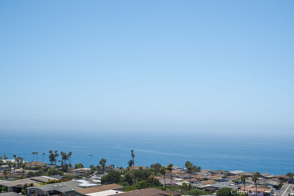 Prepare to be swept away by one of Palos Verdes Shores’ most prized possessions—a spectacular remodeled 3-bedroom, 3-bath home offers a luxurious living space, designed to maximize comfort, style, and breathtaking ocean views, covetously located at the end of a quiet cul-de-sac. Whether you’re sipping your morning coffee or entertaining under the stars, this backyard is stunning with its expansive private wraparound deck with sleek glass railings and unmatched 270-degree panoramic vistas—from Dana Point and frontal Catalina views to the distant Channel Islands. With an estimated 2,500 living square feet, nearly every inch of this home has been reimagined with quality finishes and designer touches. Enjoy an open-concept living area with a chef’s dream kitchen featuring a massive island, Thermador range, stainless steel appliances, wine cooler, and custom cabinetry. The spacious ocean-view den is perfect for a home office or creative retreat. Featuring dual master suites, each with private baths, walk-in closets, and access to private decks, this home offers both luxury and privacy. Additional highlights include new interior paint, a separate laundry room and pantry with private porch, and a large covered carport for two cars plus a golf cart with built-in storage. Nestled on a bluff on the scenic Palos Verdes Peninsula, Palos Verdes Shores MH & Golf Community is an upscale gated senior community, residents enjoy premium resort-style amenities including a 9-hole golf course, heated pool and spa, fitness center, tennis and pickleball courts, clubhouse, library, dog parks, gardens, coastal hiking trails, and 24-hour guarded security. This is a once-in-a-lifetime lifestyle opportunity to own a truly irreplaceable coastal treasure.