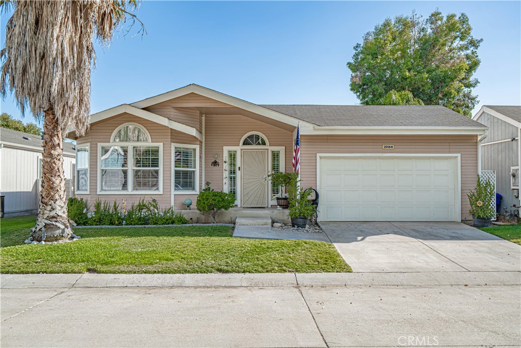 Welcome to your Dream View Home! Located in the desirable gated community of Canyon View Estates. This 1,482 square foot manufactured home has 3 spacious bedrooms and 2 bathrooms. The home features a large living room and an open floor plan, providing lots of living space. As you enter, you’ll be greeted by a warm, inviting living room featuring a cozy fireplace. The open-concept kitchen has a bright, sunny dining room and bay window. There is a large breakfast bar and lots of cabinets for storage. The primary bedroom with an ensuite bathroom has a walk-in closet and a slider leading to the back yard. The primary bathroom has a step-in shower, double vanity, and soaking tub. Additional highlights include a laundry room w/lots of storage cabinets. The home also offers a two-car garage with direct access that has a workbench, custom flooring, and cabinets. There is a sliding glass door from the living room that leads out onto the wonderful outdoor living area with breathtaking views. The backyard is a haven for relaxation with a covered lighted patio and beautiful drought-tolerant landscaping. Don’t miss the opportunity to make this beautiful house your new home. Schedule a viewing today and experience all the wonderful features this property has to offer! This home has a monthly land lease of $1,883.00 per month, which includes community amenities such as a 24-hour gate, usage of 2 pools and a spa, 2 sports courts, and 2 play areas. Canyon View also offers a community clubhouse and RV storage. The home is located near parks, bike & walking paths, shopping & entertainment, and schools. Easy freeway and MetroLink access. Home is a must-see! Buyer to verify all before the close of escrow. Welcome home!