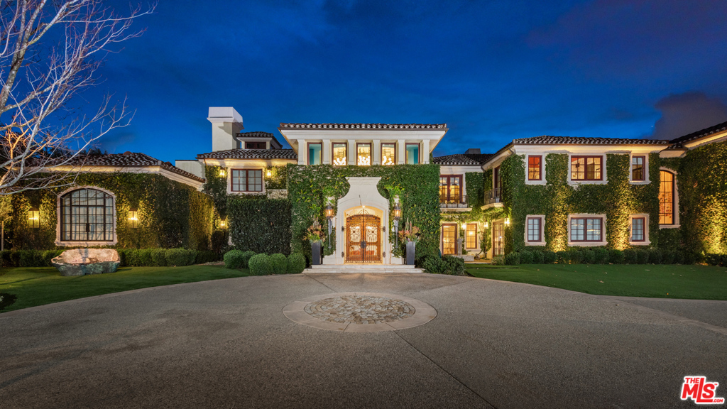 7.5 ACRE world class compound offering ample space and stunning panoramic views set in the exclusive guard gated Bella Vista Estates. Behind personal gates providing ample security and privacy, 2505 Summitridge Dr hosts the most impressive outdoor setting in all of Los Angeles. The private backyard showcases a massive infinity-edge pool, spa, cold plunge, outdoor kitchen with a custom pizza oven, dining, and large lawn area. Across the street from the main residence, you have your very own private sport court, playground and park. Incapsulating dramatic architecture infused with elegance and sophistication, the home spans ~13,000 square feet. State of the art accommodations throughout with 9 bedrooms, 11 bathrooms, multiple quintessential living spaces, a chef's kitchen, bar, custom movie theatre, game room, and wine cellar. Exuding luxury, the impressive master suite encompasses a sitting room, fireplace, walk- in closets, spacious stone filled bathrooms and a private balcony boasting unobstructed views. 2505 Summitridge Drive is the pinnacle of Beverly Hills.