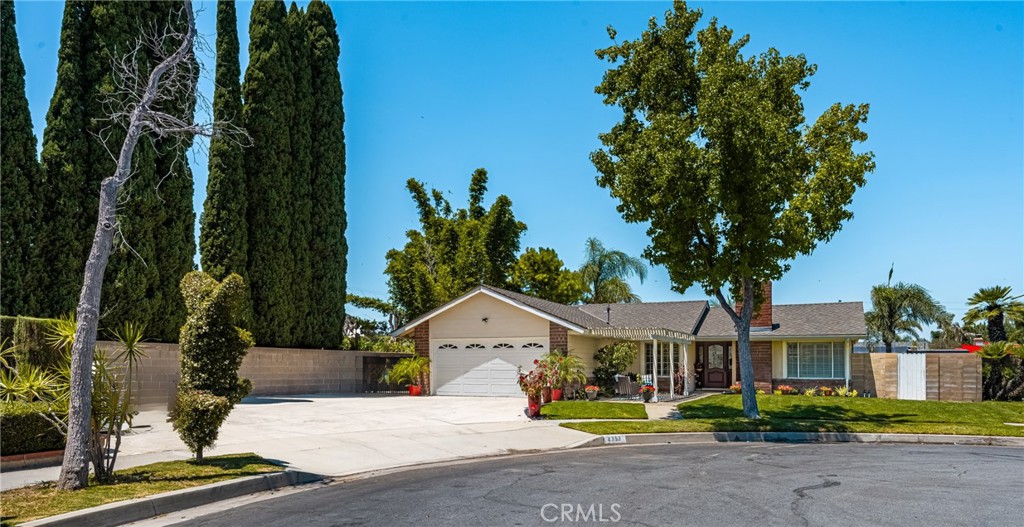 Tucked away in a peaceful Anaheim Hills cul-de-sac, this beautifully upgraded single-story pool home offers 4 bedrooms, 2 baths, and a layout designed for comfort and convenience. The spacious living room features vaulted ceilings, crown molding, wood flooring, a cozy brick fireplace, and plantation shutters. Energy Star-qualified windows and recessed lighting add to the home’s efficiency and charm. The updated kitchen boasts granite countertops, a center island, stainless steel appliances, and a pantry—perfect for everyday living and entertaining. French doors in the primary bedroom open to a private backyard retreat complete with a sparkling pool and spa, covered patio, fruit trees, and a side dog run. Additional highlights include mirrored closets, six-panel doors, ceiling fans, a water softener system and wood flooring throughout. With a wide driveway suitable for extra cars or RV parking, a two-car garage equipped with an EV charging outlet, upgraded HVAC system, water softener, roof, house insulation, water heater, energy-efficient pool pump and rain gutters—this home is move-in ready. Located in an award-winning Canyon High School district, within walking distance to Riverdale Park, shopping, and dining, with easy freeway access. No HOA. Welcome Home, this one's ready for you!