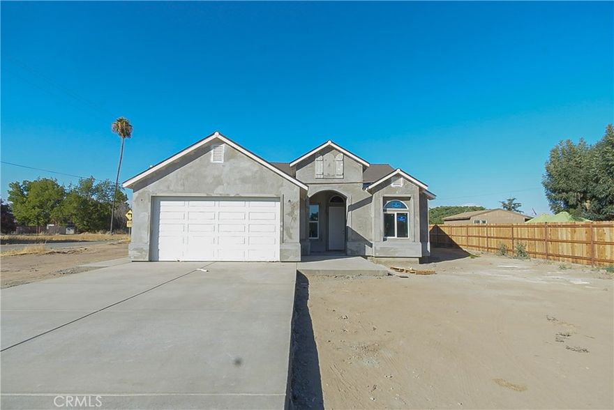 Brand-new construction home! This beautifully designed 4-bedroom, 3-bath home will sit on a spacious corner lot offering modern style, energy efficiency, and everyday comfort. The exterior will feature clean stucco, dual-pane windows, and an impressive 8-foot entry door leading into an open-concept living space perfect for today's lifestyle. The kitchen will include a large island, walk-in pantry, and a cozy dining nook. The private primary suite will offer direct access to the backyard and include a stylish ensuite bathroom with a tiled walk-in shower, double sinks, and a walk-in closet. Three additional bedrooms will provide generous closet space, and a third full bathroom will add convenience for guests or family. Additional features will include an indoor laundry room, a finished 2-car garage, and a spacious backyard with a patio ready for your personal touch. Don't miss your chance to own this stunning new construction home!