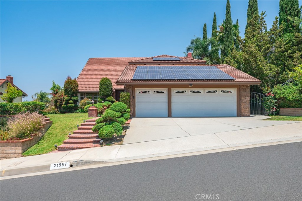 Stunning Home with Breathtaking Mountain & City Views in South Diamond Bar Nestled in the serene hills of South Diamond Bar, this beautifully maintained home offers 4 bedrooms, 3 bathrooms, and 2,712 sq.ft. of bright, open living space on a generous 9,297 sq.ft. lot. Step inside to be welcomed by soaring high ceilings, abundant natural light, and an elegant staircase that sets the tone for this inviting home. Large windows throughout frame picturesque views, bringing the outdoors in. The formal living and dining areas flow seamlessly—perfect for entertaining. The spacious kitchen opens to a cozy family room with a fireplace and extends to a thoughtfully designed outdoor entertainment area, ideal for hosting gatherings or enjoying quiet family evenings under the stars. Downstairs features a convenient guest bedroom, perfect for visitors or elder living. Upstairs, the oversized primary suite boasts a private sitting area, a large walk-in closet, and a luxurious en-suite bathroom with dual sinks, soaking tub, and separate shower. Additional features include a 3-car garage, solar panels, and beautifully landscaped grounds. Located in a peaceful, sought-after neighborhood, this home is just minutes from H Mart, shopping, restaurants, parks, and top-rated Diamond Bar High School. Easy access to 57 & 60 Freeways makes commuting to Orange County, Los Angeles, and surrounding areas a breeze. Welcome to your new home!