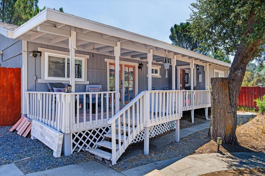 Discover this beautifully updated 2-bedroom, 2-bathroom home nestled on a spacious corner lot in the tranquil countryside of Campo. Perfect for those seeking peaceful rural living with stunning scenic views, this residence offers a perfect blend of comfort and convenience. Recent remodeled interior include a modernized kitchen with shaker cabinets, quartz countertops new stainless appliances, fresh flooring throughout, energy efficient dual pane windows, tankless water heater and a brand-new roof, ensuring worry-free living. Indoor laundry with folding area. The bonus room provides flexible space for a home office, guest room, or additional living area. An exterior shed offers ample storage for tools, equipment, or outdoor gear. Enjoy the serene outdoor surroundings and the privacy of this charming property. Whether you're relaxing inside or taking in the breathtaking views outside, this home is a wonderful opportunity for rural living with modern updates.