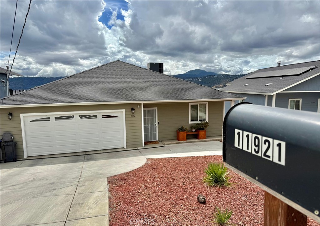A true relaxation retreat! Built in 2020, this Beauty still feels like a new home. Complete with outright owned solar panels, EV power wall in the garage (two car connection), along with a multimillion-dollar lake view this is a deal that should not be passed up. Among some of the amenities this wonderful place has to offer are: Walk-in jetted tub in the main bathroom, separate shower, as well as double sinks with anti fog mirrors, and walk in closet. Main living area offers open floor plan with recesssed lighting, wood burning fireplace, attached/covered deck with a panoramic view to the lake, as well as remote control shades for living area and dining area. Kitchen is larger than expected with 5 burner gas stove , granite counter tops, large island, instant Hot Water Dispenser (allowing you to have hot water on demand for tea), French Door style refrigerator complete with ice maker and water dispenser. Kitchen sink and refrigerator have an added filtration system. Laundry room with washer and dryer included. Attached two car garage with mini split. Additionally home has a water softener. Bonus room downstairs with a separate entrance. Property is part of Lily Cove HOA that provides access to dock, club house, and picnic area. Come see it for yourself!