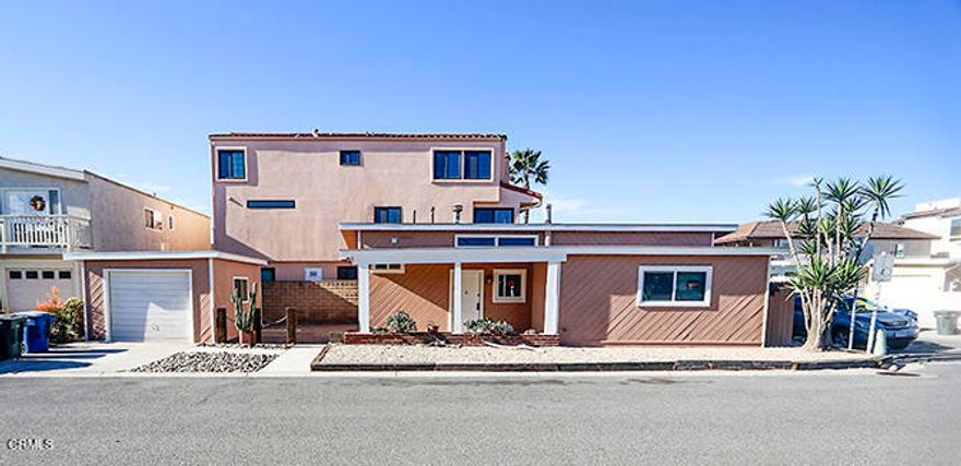 Enjoy beach side living nestled between the ocean and harbor at Hollywood Beach.  This delightful cottage features open beam ceilings, vinyl plank flooring, remodeled kitchen cabinets and quartz countertops, dual pane windows and a large paver patio ideal for outdoor gatherings.  Well located on the cornor of Los Files and Sunset, you're just steps to the beach, marina, restaurants and local farmers market.  This is an ideal coastal retreat for those who love sun, sand and seaside strolls.