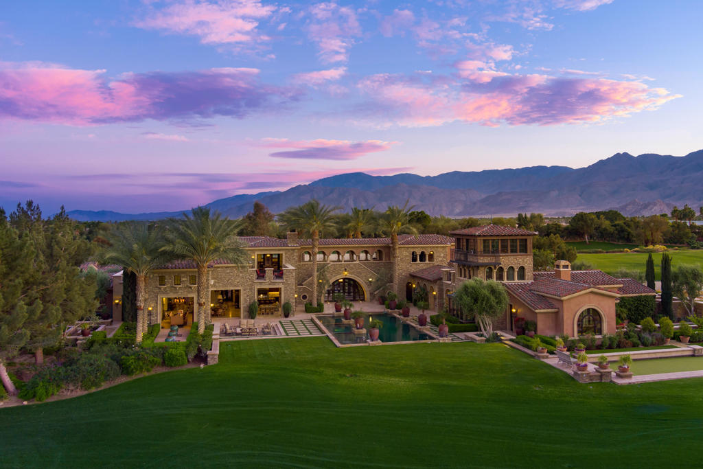 Regal Italian Village Estate at the Madison Club! Five full bedroom suites, six full baths, two powder rooms plus office and game room. Approx. 8,246 sq. ft. on over an acre of manicured grounds. Features a double door entryway to foyer and outdoor entertainment area for perfect event access. Great room with towering ceiling hosting floor to ceiling custom fireplace with media. Formal dining room and gourmet Tuscan Country kitchen with large island, top of the line appliances, a separate catering kitchen and wine cellar. Handsome library office with beautiful wood built-ins and wood paneling floor to ceiling. The master suite hosts fireplace with media niche, sitting area and spa inspired bath with private meditation patio. The private guest suites are suited for cozy family gatherings. The retreat tower offers three stories of getaway space with sitting room, mezzanine and third floor sunroom ''eagles nest'' with forever views. This home was built with no expense spared with intricate detail to every inch. Walls of glass open to the most amazing extended loggia with two-way fireplace, B.B.Q. kitchen, pizza oven, bar and dining area. Stunning resort like infinity pool flanked with gorgeous pots of palms with inlaid spa and waterfall. Grass grouted pavers lead to step down fire pit with seating area, and a professional Bocce Ball court. Located on the 12th fairway of this Tom Fazio designed course. Furnished per inventory. Madison Membership is separate and mandatory.