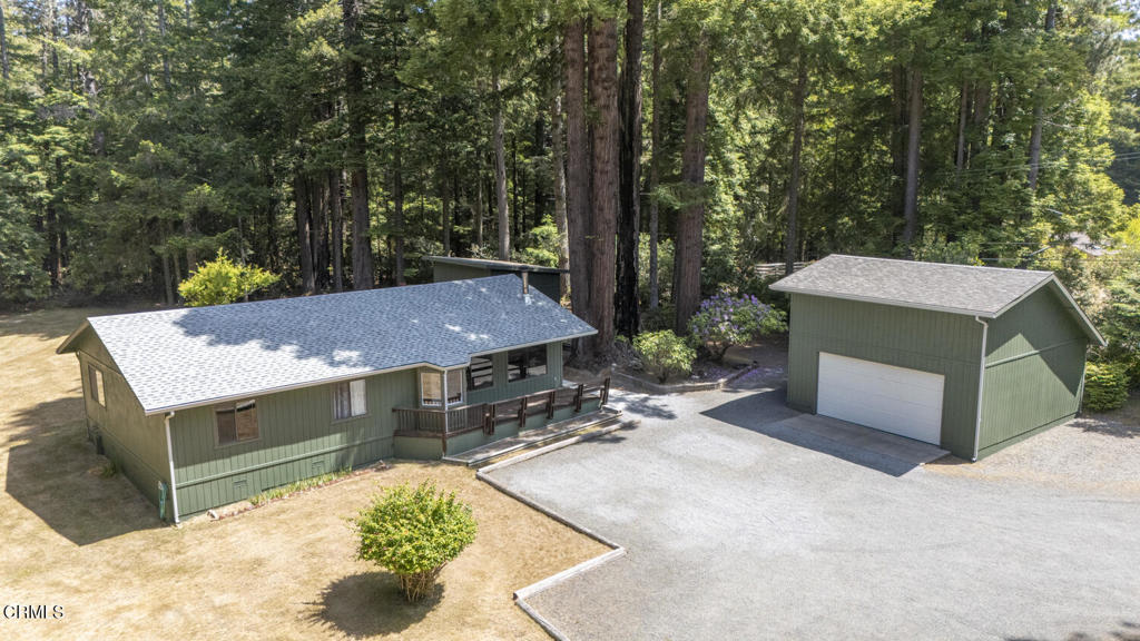 Awaken to singing birds in this serene 1.5 acre property nestled just moments from Mendocino Village, schools, and scenic Headlands State Park. Set in a sun-drenched meadow dotted with fruit trees and bordered by majestic redwoods, this peaceful retreat offers both privacy and convenience.Recent exterior upgrades including new roof, gutters, leach lines and fresh paint mean the heavy lifting is done freeing you to personalize the interior with your creative touch. Relax and enjoy the warmth of the Fischer woodstove. You will appreciate lots of closet space with built-ins for generous storage.The spacious two car garage features an upstairs bonus room, which is perfect for a studio, office, or guest space. A separate workshop invites hands on projects, while the 5000 gallon water storage tank provides peace of mind.Just a mile from the ocean and Mendocino Village with charming shops, restaurants and beaches at your finger tips. This property is a rare blend of seclusion and accessibility. Come experience the magic of Mendocino living.