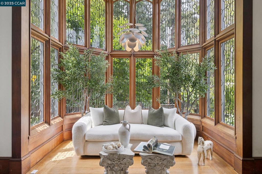 A Rare Architectural Legacy! Built in 1912 by Walter Ratcliff, this exceptional 3BD/2.5BA residence offers a rare chance to own a beautifully preserved piece of Berkeley’s storied past thoughtfully updated for modern living. Set on an 8,820 sf lot, the 2,048 sf home is surrounded by tiered, landscaped gardens with mature trees, vibrant blooms, & multiple seating areas. A motorized gate opens to a brick-paver driveway with space for 5 vehicles. Inside, the grand living room is anchored by striking, meticulously restored leaded glass windows—a hallmark of the home's architectural pedigree—soaring cathedral ceilings, & a plaster-surround fireplace. The formal dining room features original built-ins, garden views, & a second fireplace. A fully remodeled chef’s kitchen includes a marble island, custom cabinetry, & premium appliances. Throughout the home: hardwood floors, beamed ceilings, custom stairwell, & finely crafted woodwork. The primary suite offers a sitting area, walk-in closet, & bonus storage. Additional highlights include remodeled baths, Elfa® closets, secret bedroom nook, tankless water heater, laundry, shed, & secured gate. Step into timeless elegance and become the next steward of this iconic Berkeley residence. This is more than a home—it’s a piece of history.