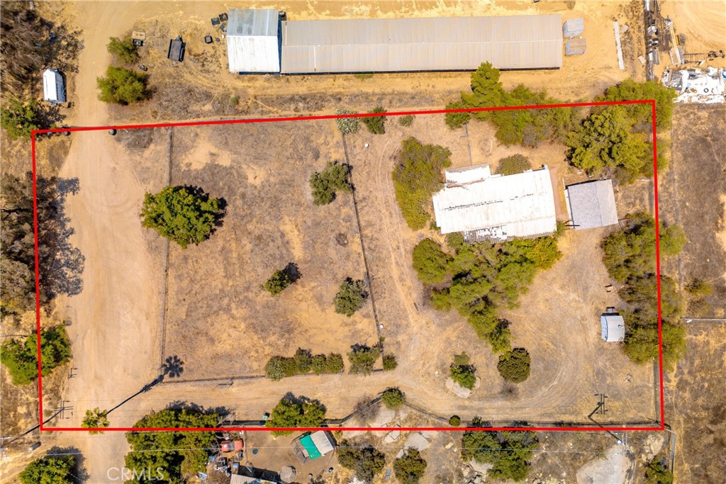 1.25 acres with manufactured home with detached garage. The land is fully fenced and has much possibility. The manufactured home is probably a tear down, the value is in the land. There is a septic and city water.