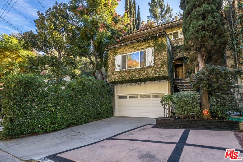 Now priced under market value for a swift sale, this Wonderland Avenue tree house is as sweet as can be. Tucked away in iconic Laurel Canyon, this magical Mediterranean-style hideaway blends warmth, privacy, and Hollywood history. Originally built in 1966 and lovingly preserved, this 2-bed, 2-bath canyon retreat is rich in natural light and timeless charm. Thoughtfully updated with a designer's eye, the home offers multiple outdoor spaces ideal for both entertaining and quiet reflection-from the built-in BBQ patio to the hillside spa deck under the trees. Inside, hardwood floors, custom tile, and a layout that flows naturally between indoor and outdoor living. The peaceful primary suite includes quiet views while the second bedroom makes the perfect office, guest room, or creative space. Located just minutes from Sunset, West Hollywood, and Studio City, this one-of-a-kind property offers the serenity of a canyon sanctuary with unbeatable city access. Within the Wonderland School District and set on a quiet stretch of storied Wonderland Ave, this is the kind of home people dream of. Don't miss your chance to own a true Canyon classic.